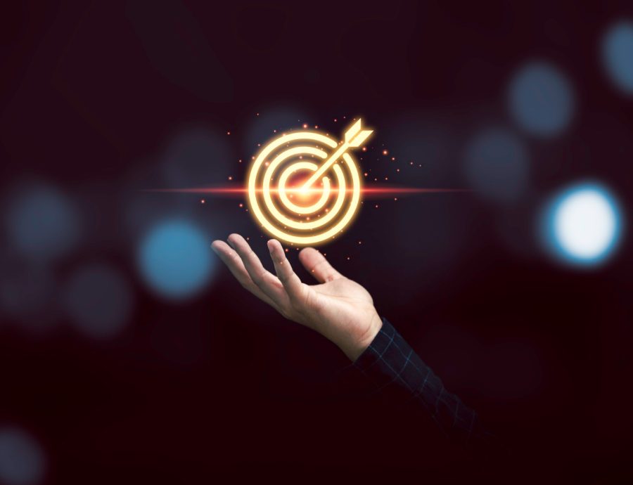 businessman-holding-virtual-golden-target-dartboard-for-focus-and-achievement-business-objective-concept